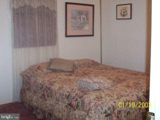 80 Pinehurst Road Ocean Pines, MD 21811 - Photo 8 of 9 a bedroom with a bed and a window