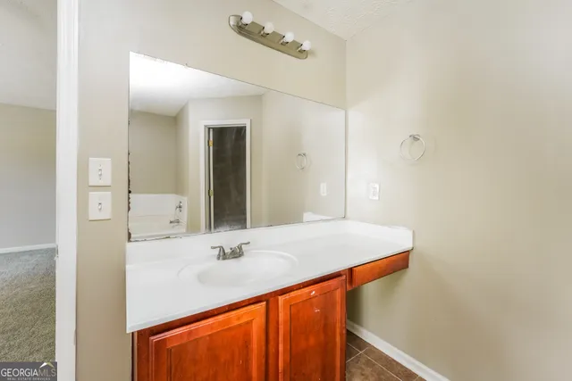 a bathroom with a bathtub and shower