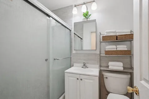 a bathroom with a sink and mirror