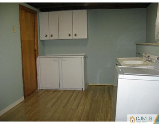 13 Glen Gary Road Middlesex, NJ 08846 - Photo 22 of 23 a view of storage and utility room with wooden floor