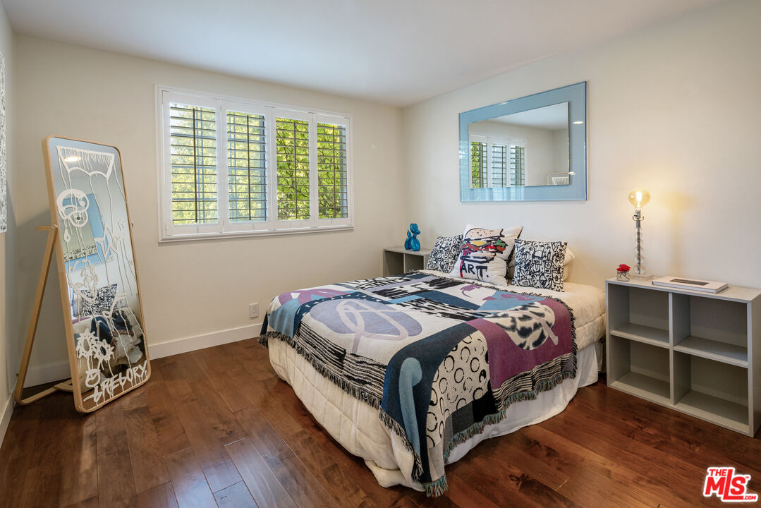 9732 Rotta Avenue Sunland, CA 91040 - Photo 13 of 22 a bedroom with a bed and a window
