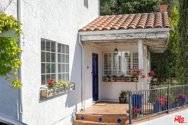 a front view of a house with a porch