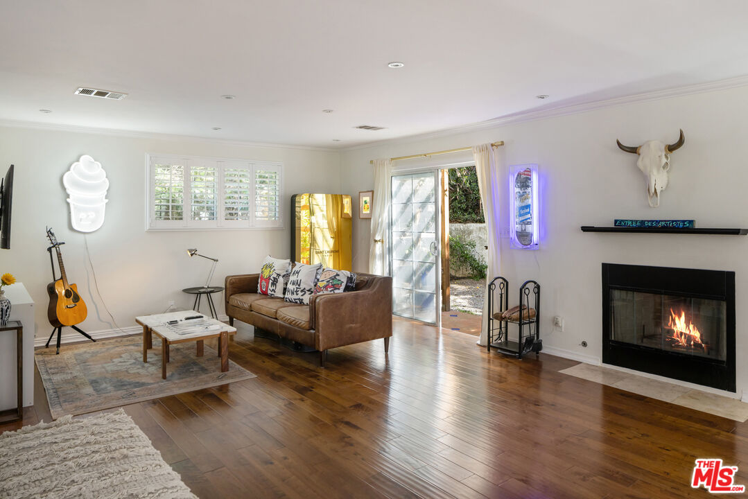 9732 Rotta Avenue Sunland, CA 91040 - Photo 4 of 22 a living room with furniture two window and a fireplace