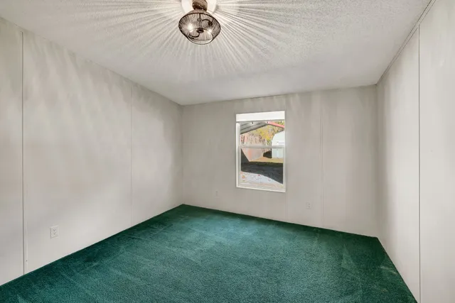 a view of an empty room and closet area