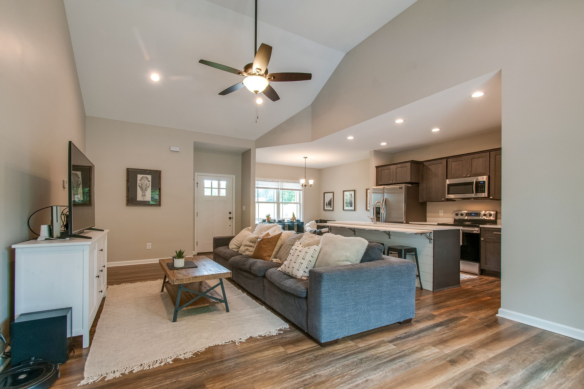 114 Black Road Dickson, TN 37055 - Photo 5 of 29 a living room with kitchen island furniture and a chandelier