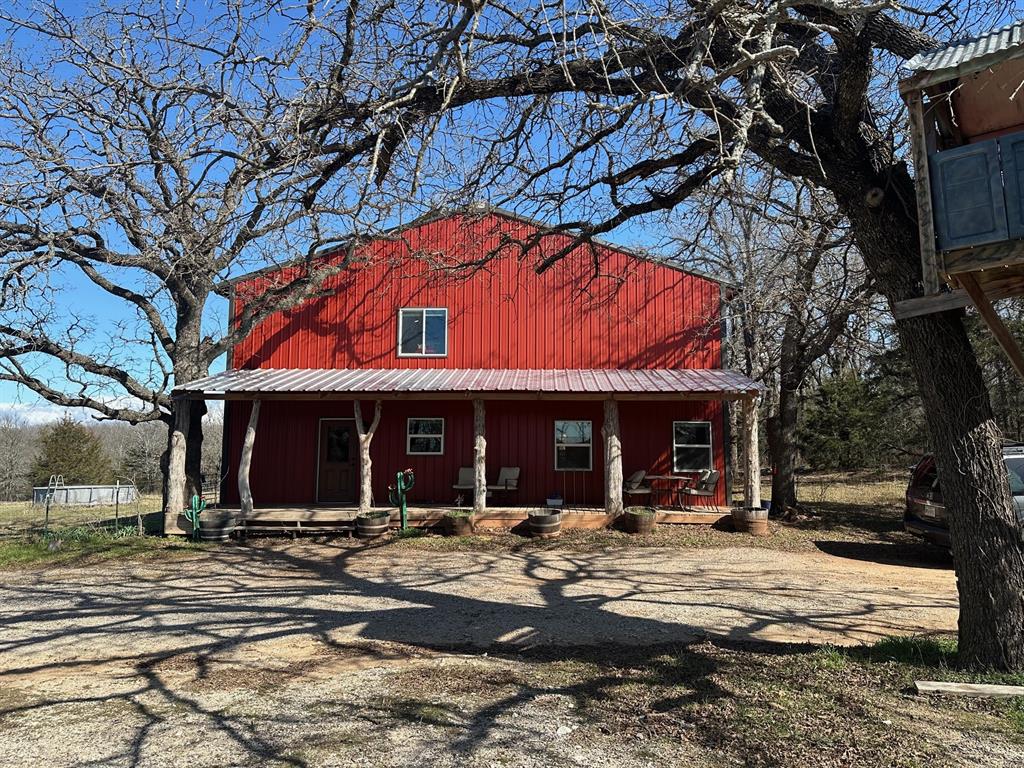 1749 Fm 2265 Road Alvord, TX 76225 - Photo 1 of 1 View of front of house with a porch and metal roof