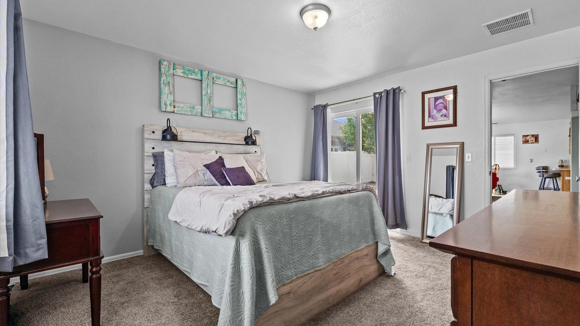 420-29 29 1/2 Road Grand Junction, CO 81504 - Photo 14 of 26 a bed sitting in a bedroom next to a window