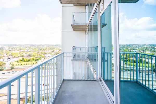 a view of a balcony with ocean view