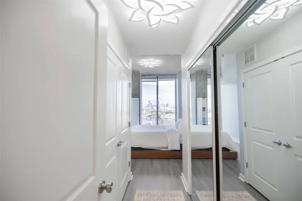 a bathroom with a tub shower and sink