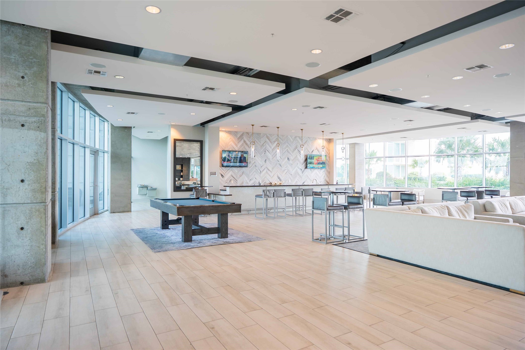 5925 Almeda Road, Unit 12005 Houston, TX 77004 - Photo 24 of 25 a large white kitchen with lots of counter space and windows