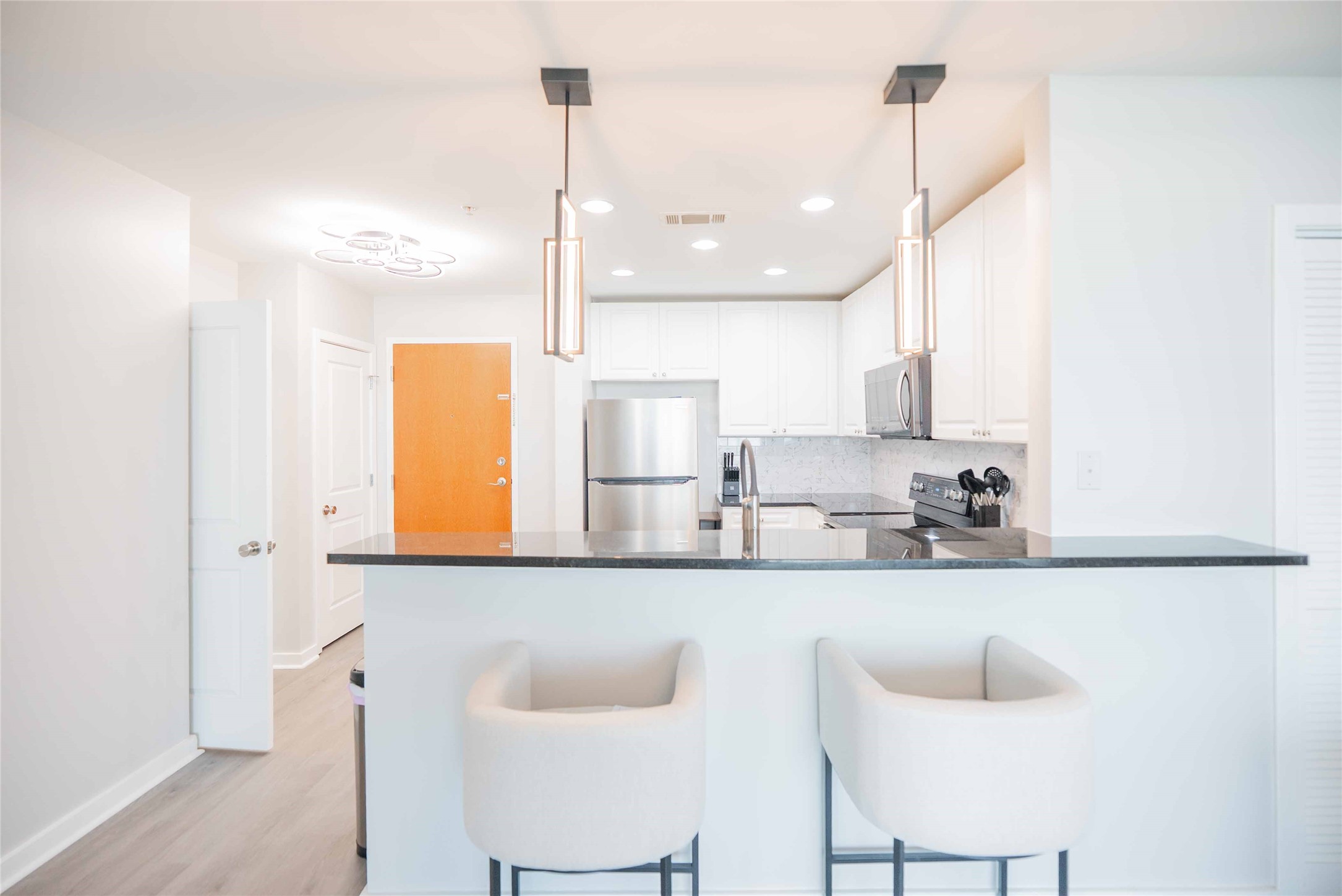 5925 Almeda Road, Unit 12005 Houston, TX 77004 - Photo 6 of 25 a kitchen with stainless steel appliances kitchen island a sink a refrigerator and cabinets