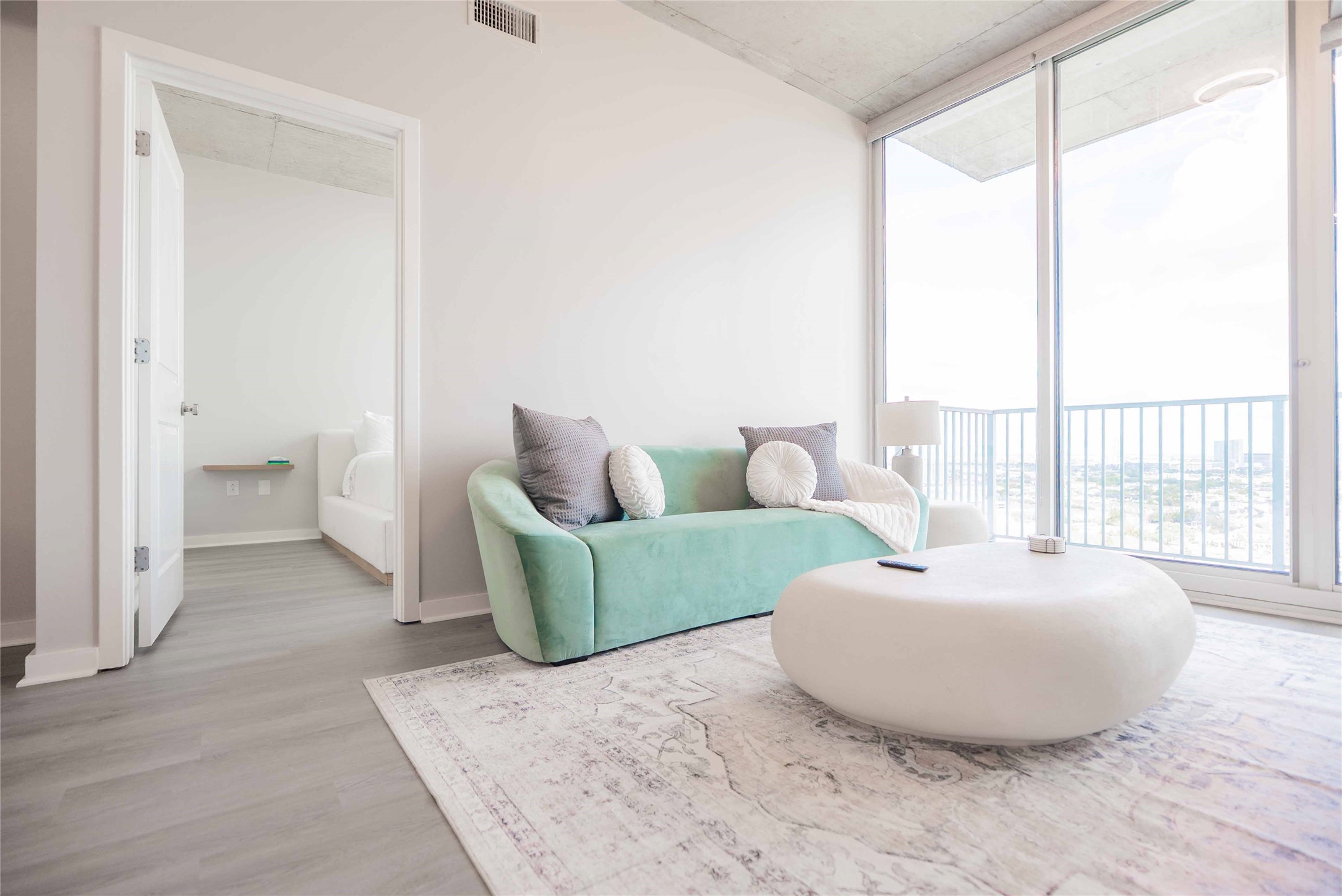 5925 Almeda Road, Unit 12005 Houston, TX 77004 - Photo 9 of 25 a living room with furniture and a large window