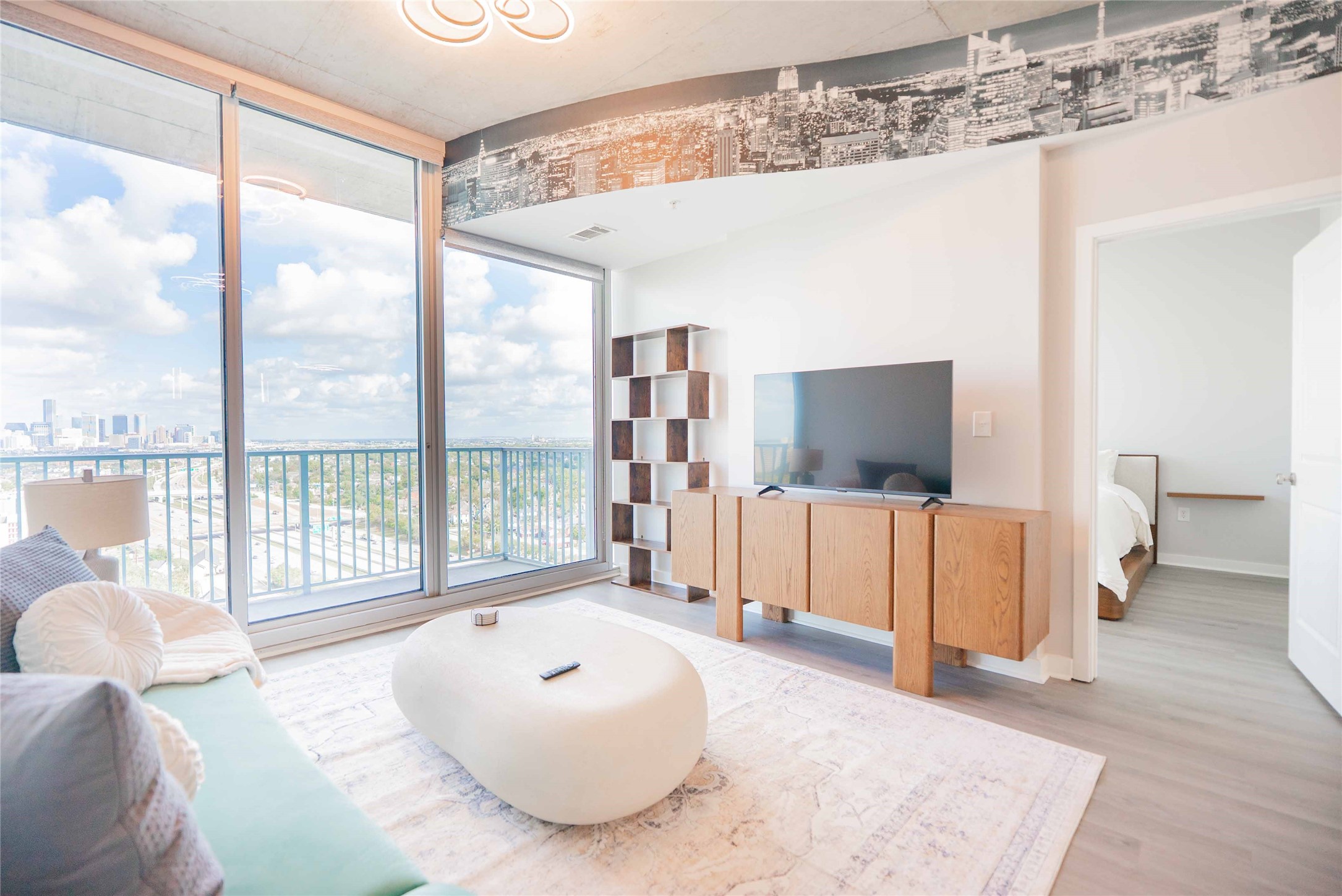 5925 Almeda Road, Unit 12005 Houston, TX 77004 - Photo 10 of 25 a living room with furniture and a flat screen tv