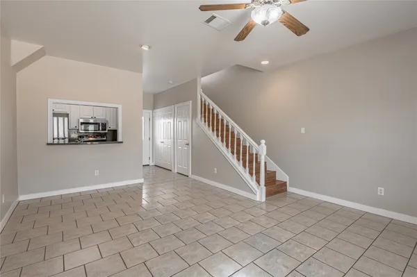 a view of an entryway with wooden floor