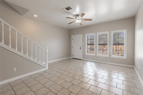 a view of an empty room with windows