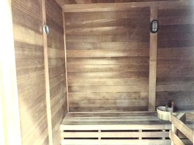 a view of a swimming pool with outdoor seating and a lake view