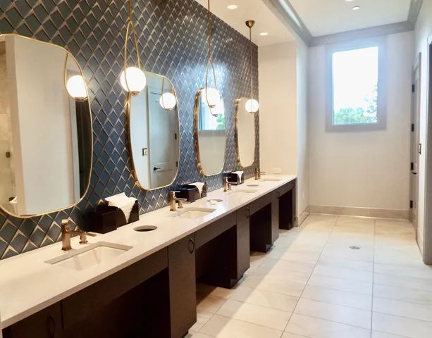 a view of swimming pool with outdoor seating and house in the background