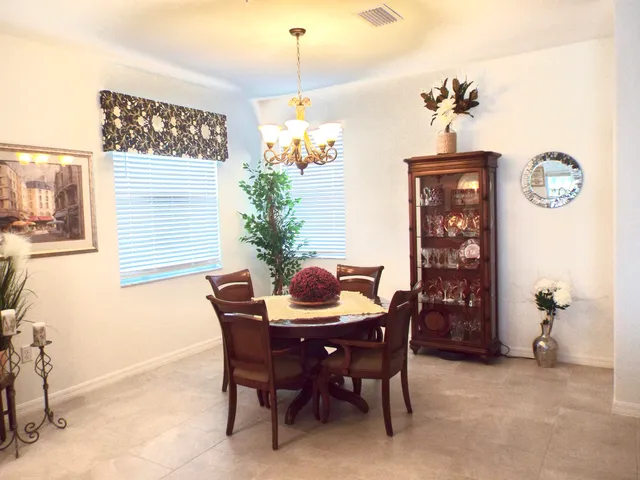 a bedroom with a bed couch and a window