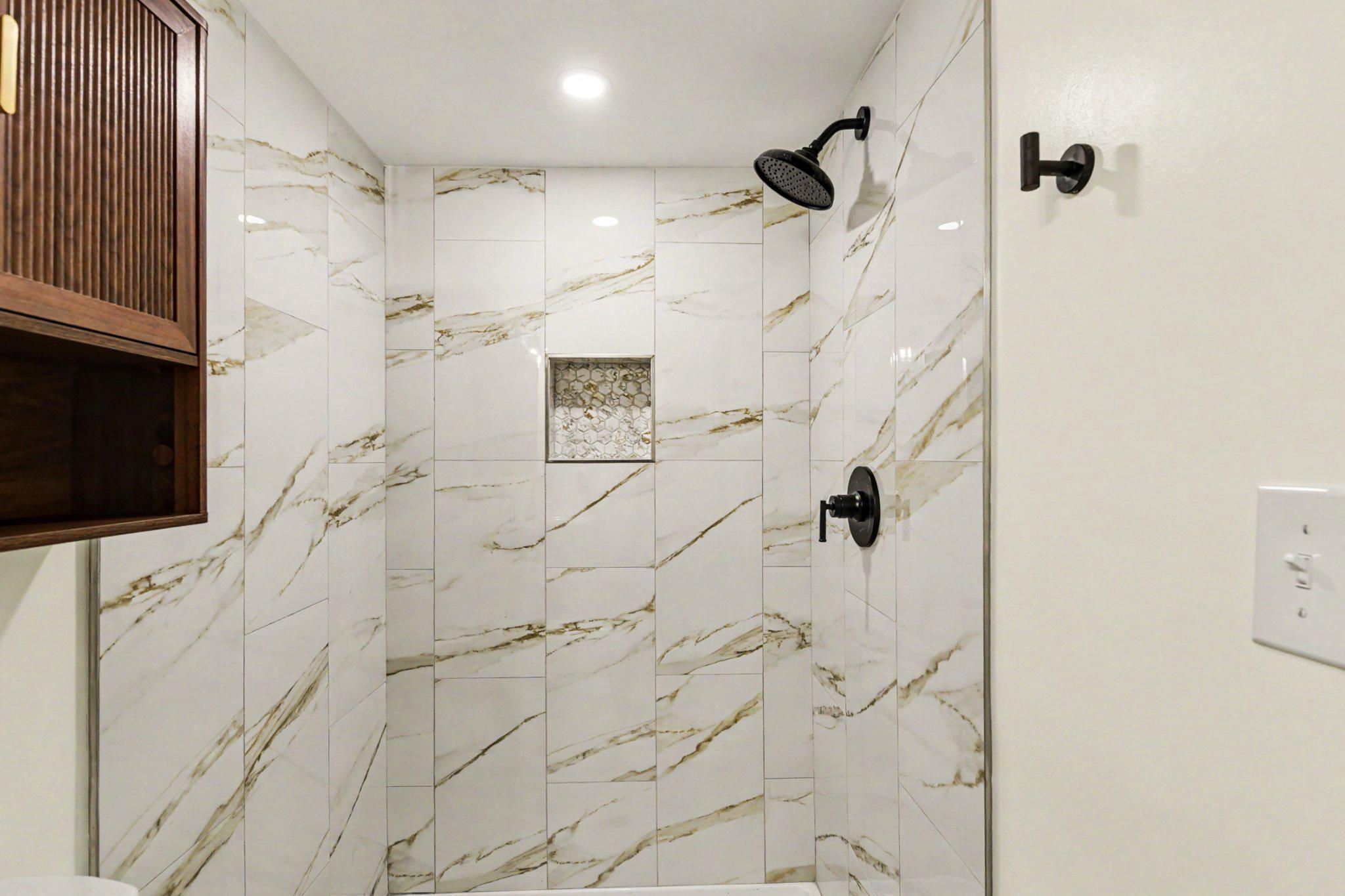1635 Walterswood Road Baltimore, MD 21239 - Photo 26 of 33 1st fl. shower w. luxurious marble shower retreat.