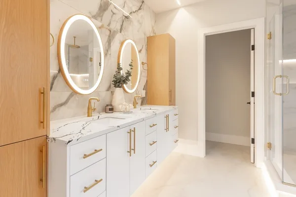 a bathroom with a double vanity sink and a mirror