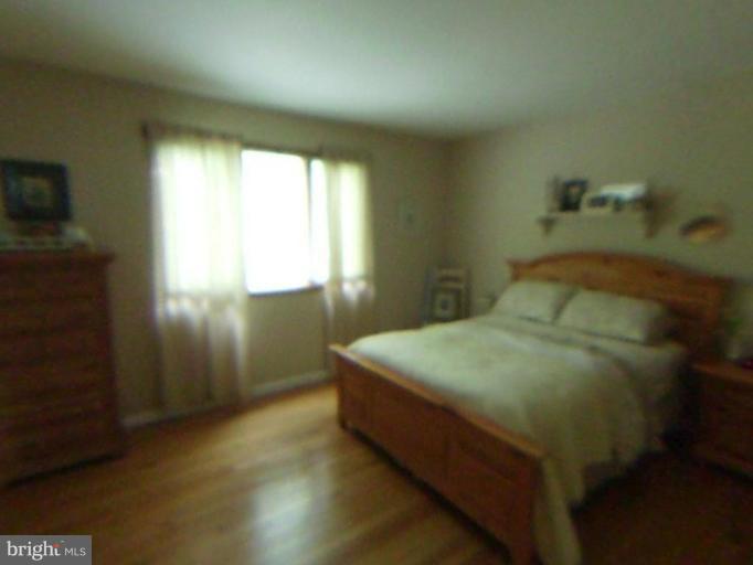 9219 Sandra Park Road Perry Hall, MD 21128 - Photo 4 of 11 a bedroom with a bed and a window