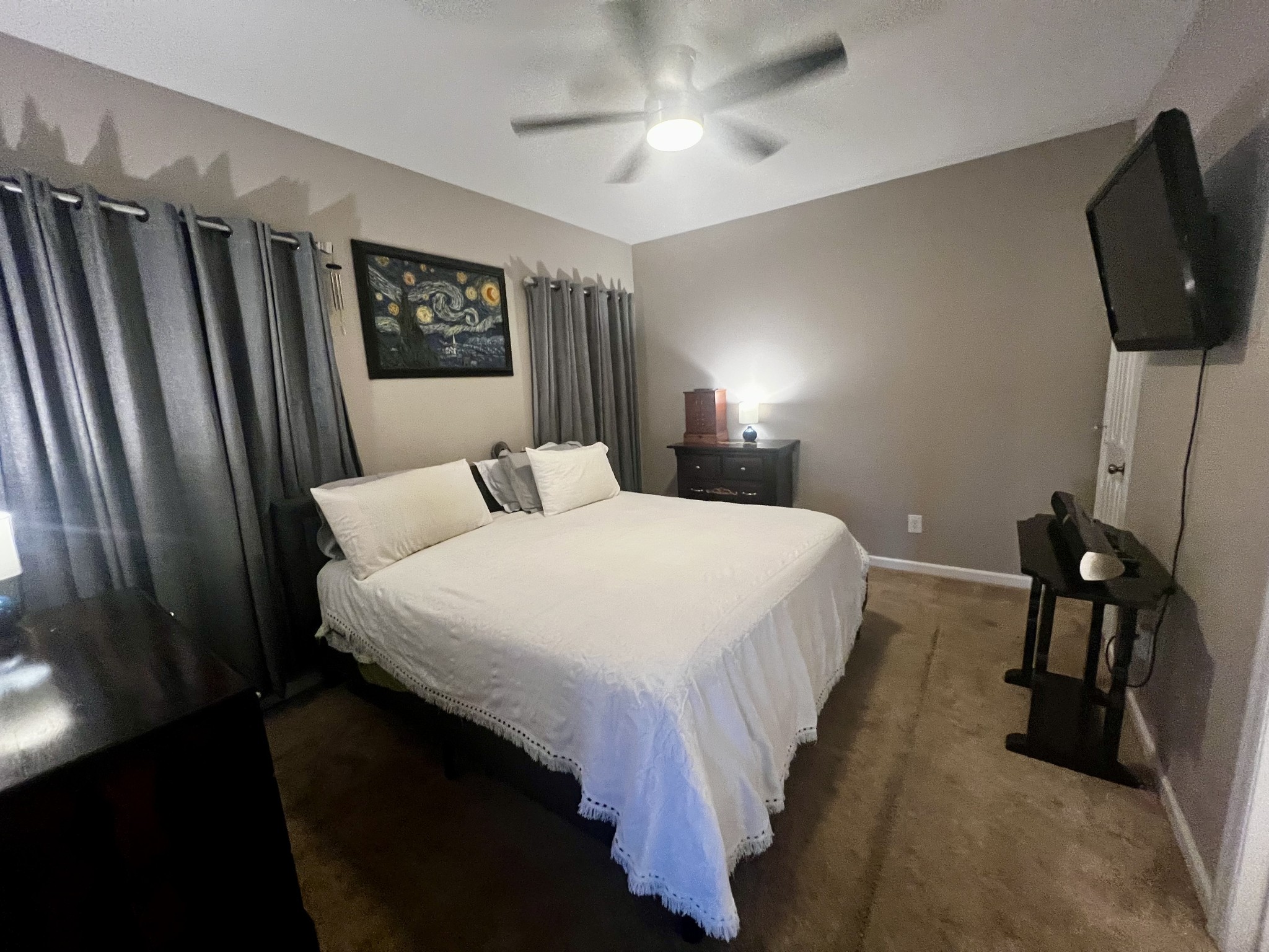 305 Duncan Lane Winchester, TN 37398 - Photo 13 of 34 a bedroom with a bed window and a flat screen tv