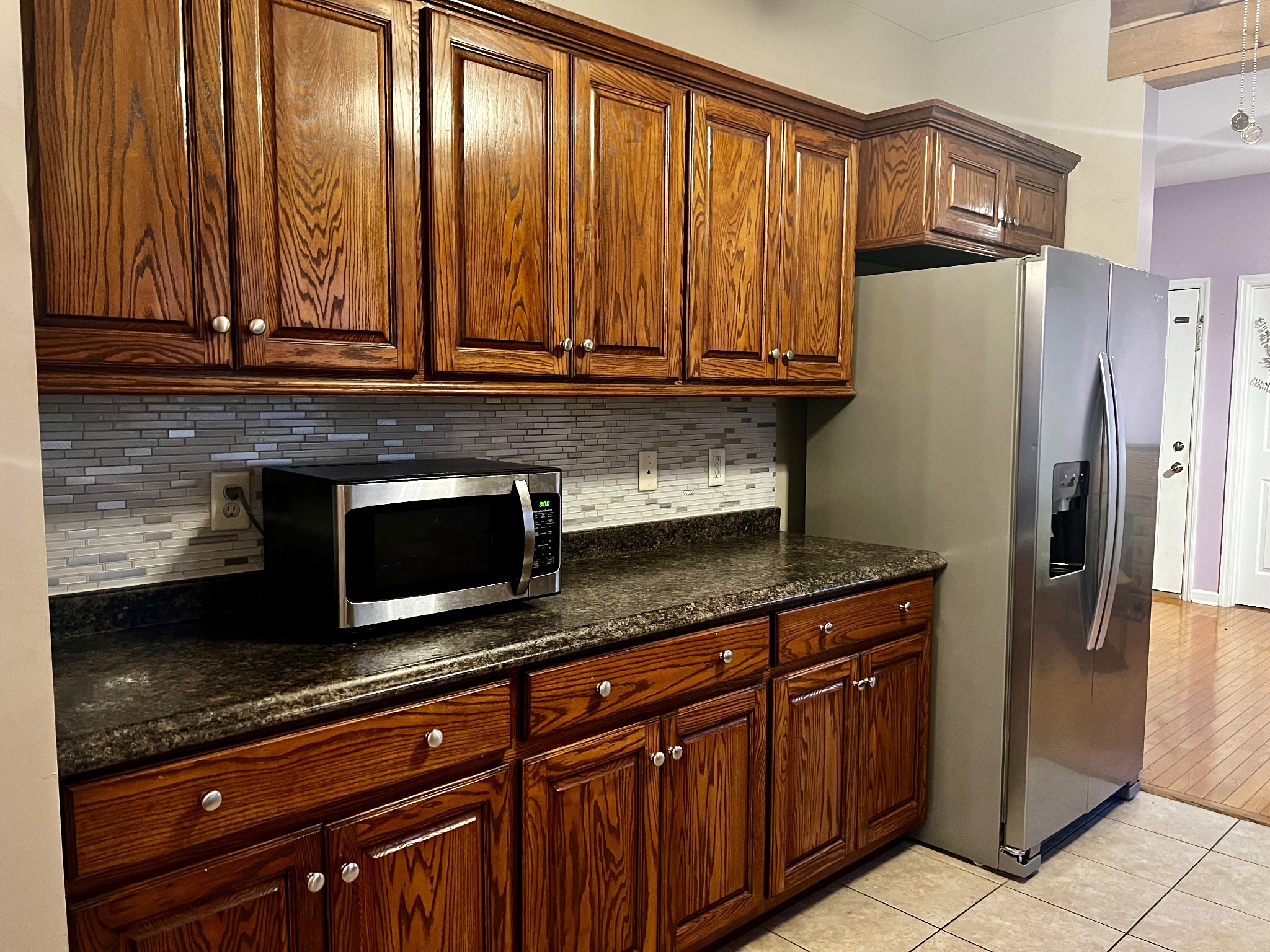 305 Duncan Lane Winchester, TN 37398 - Photo 18 of 34 a kitchen with stainless steel appliances granite countertop a refrigerator and a stove