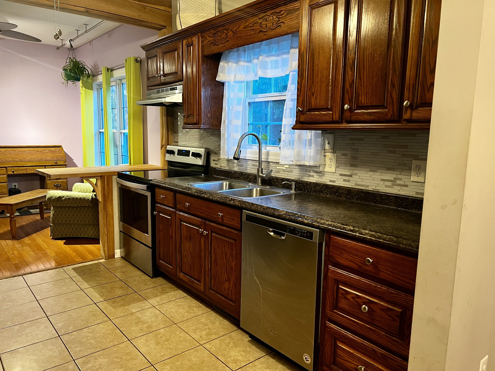 305 Duncan Lane Winchester, TN 37398 - Photo 19 of 34 a kitchen with stainless steel appliances granite countertop a sink stove and cabinets