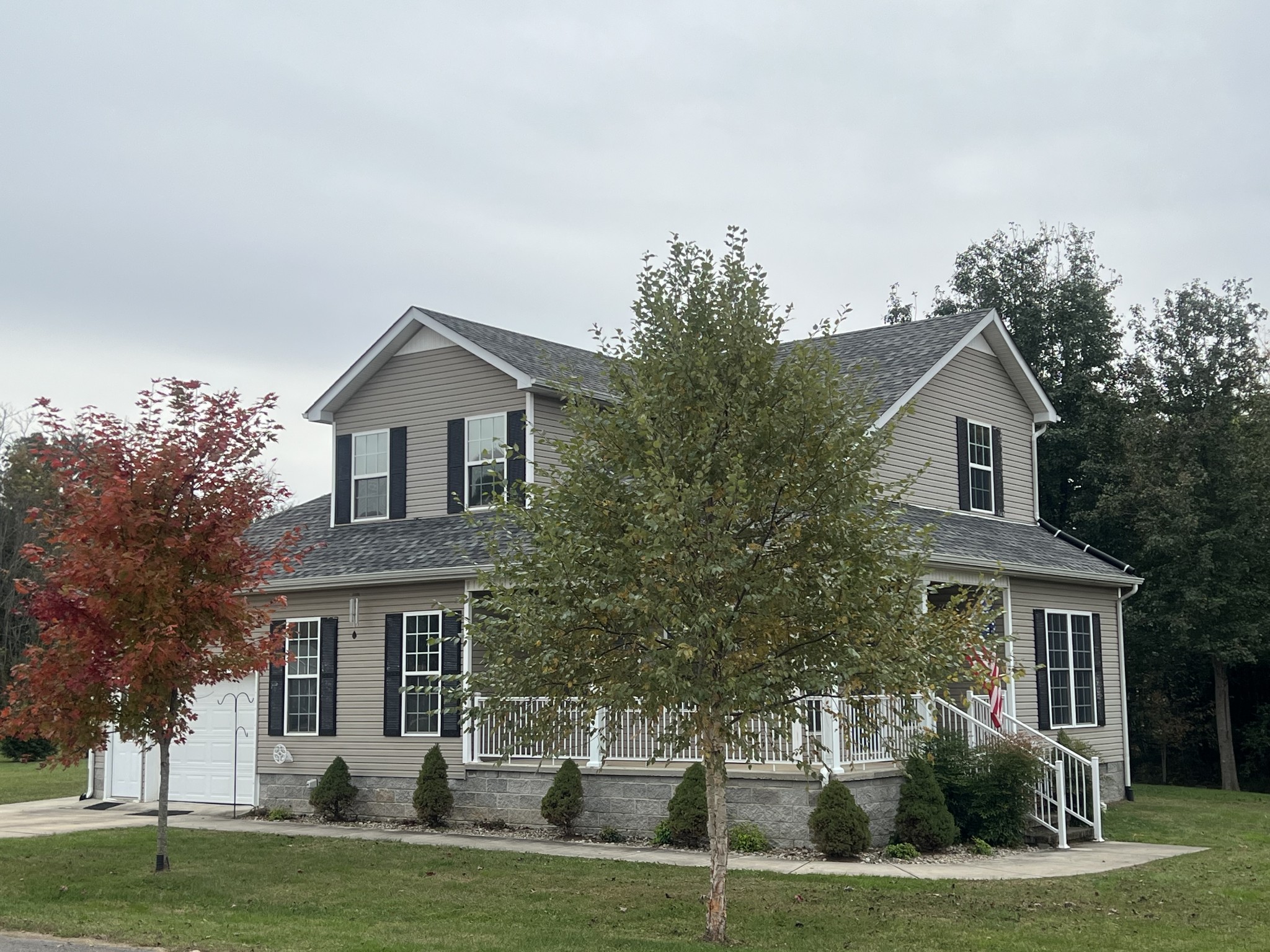 305 Duncan Lane Winchester, TN 37398 - Photo 2 of 34 a front view of a house with a garden and trees