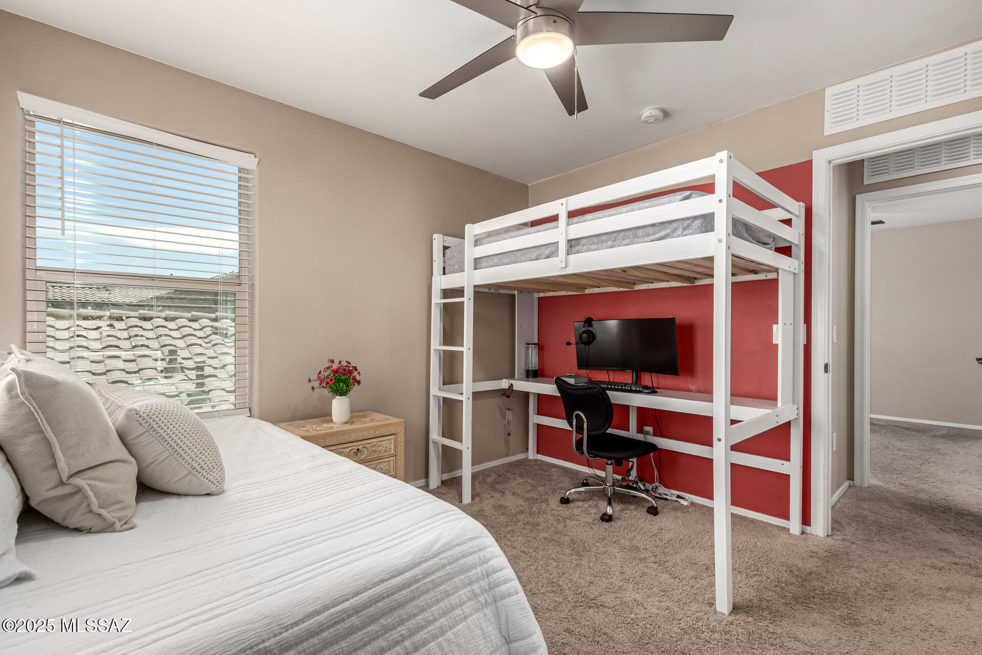 9528 Desert Fauna Loop Tucson, AZ 85747 - Photo 28 of 46 a bedroom with a bed and a flat screen tv