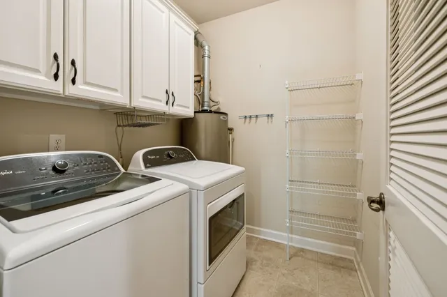 an empty room with closet and a ceiling fan