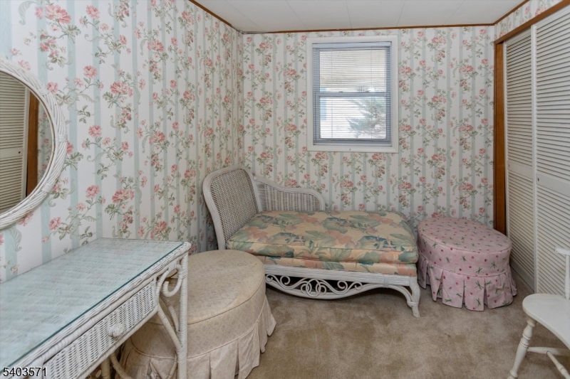 195 West Main Street, Unit G Chester, NJ 07930 - Photo 18 of 23 a bedroom with a bed and a flat screen tv