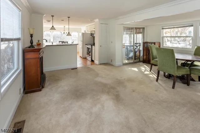a kitchen with refrigerator and cabinets