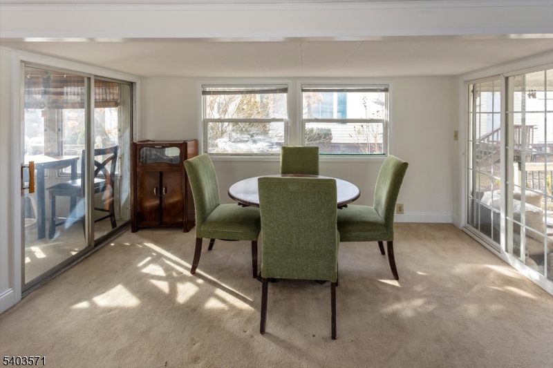 195 West Main Street, Unit G Chester, NJ 07930 - Photo 7 of 23 a view of a dining room with furniture window and outside view