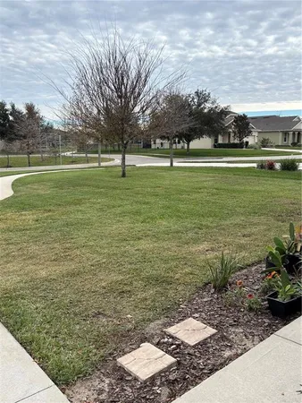 a view of a golf course with a lake