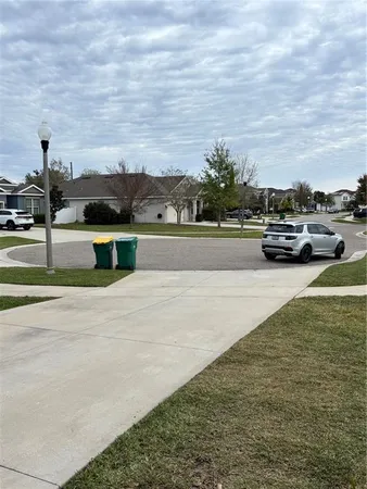 a view of a yard with a trampoline