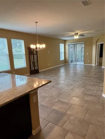 a view of a kitchen with a sink and a window