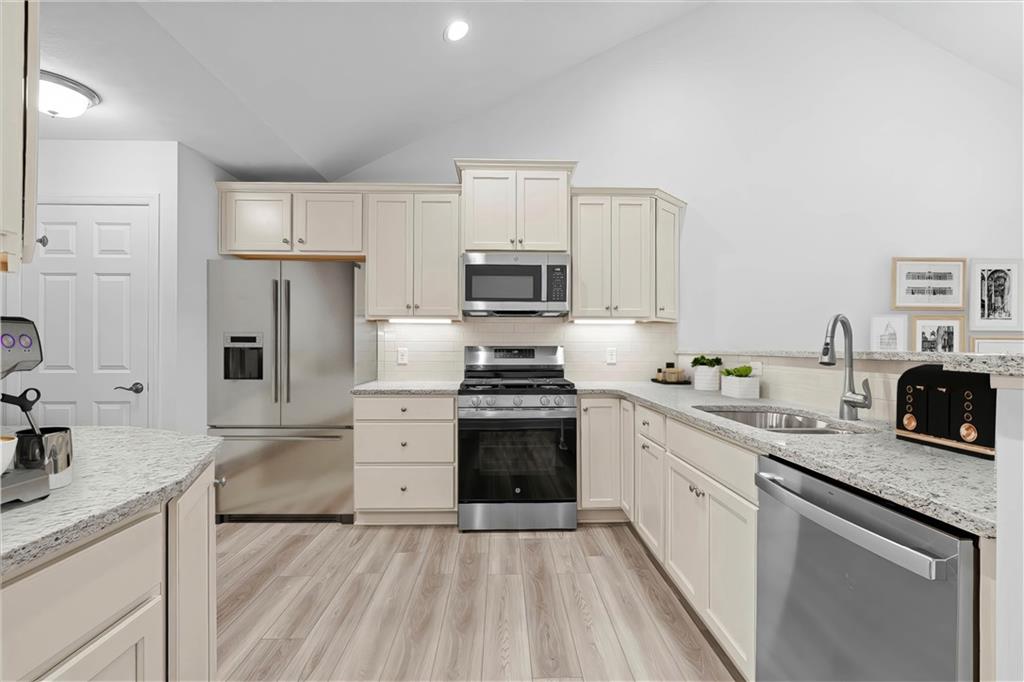 1261 Sandy Rdg Drive Sarver, PA 16055 - Photo 18 of 28 a kitchen with granite countertop a sink stove and refrigerator
