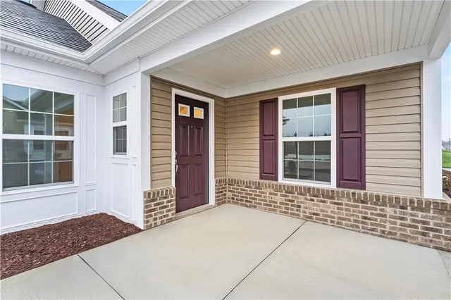 a front view of a house with a large window