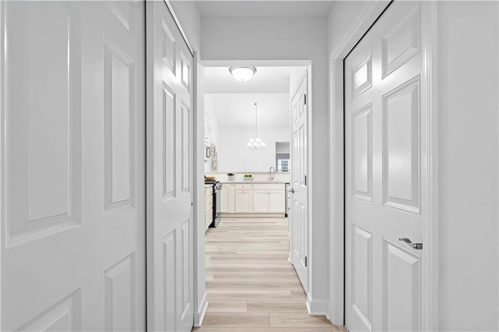 1261 Sandy Rdg Drive Sarver, PA 16055 - Photo 22 of 28 a view of a hallway with wooden floor cabinets and a kitchen