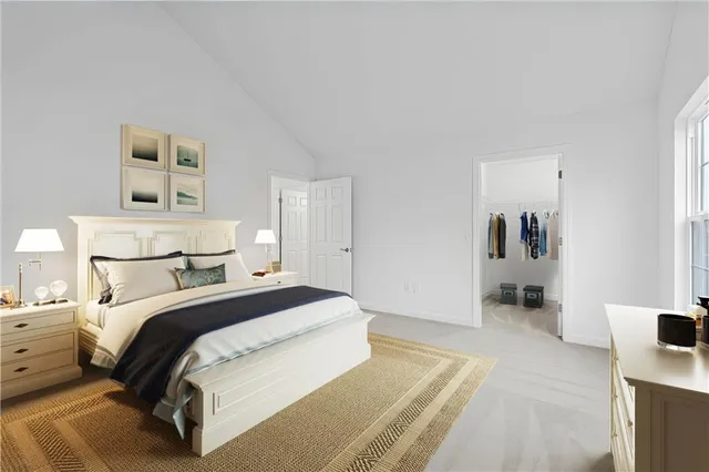 a bedroom with a bed and lamp