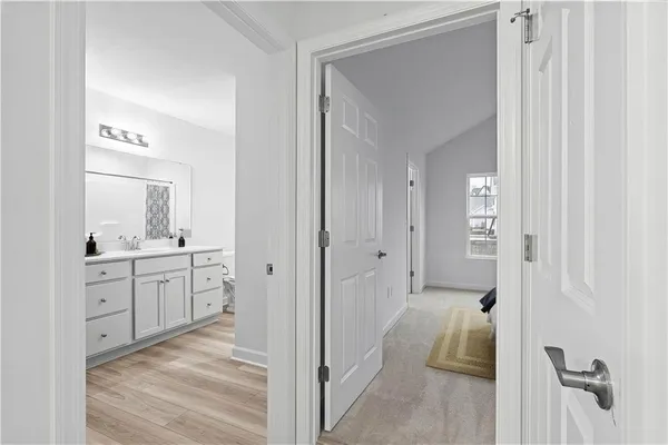 a spacious bathroom with a shower and a sink