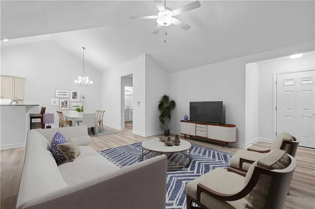 a living room with furniture and a flat screen tv