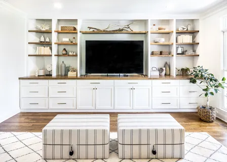 a living room with a couch and a stove top oven