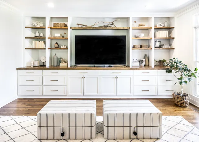 a living room with a couch and a stove top oven