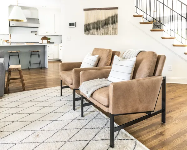 a kitchen with a microwave a sink and cabinets