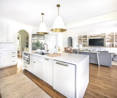 a spacious bedroom with a bed and a large window