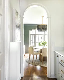 a bedroom with a bed a table and chair