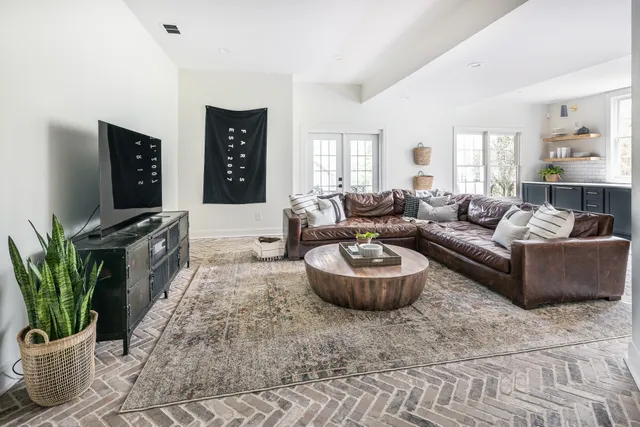 a backyard of a house with a table and chairs