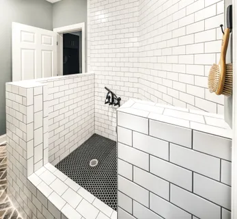 an aerial view of residential house with outdoor space and trees all around